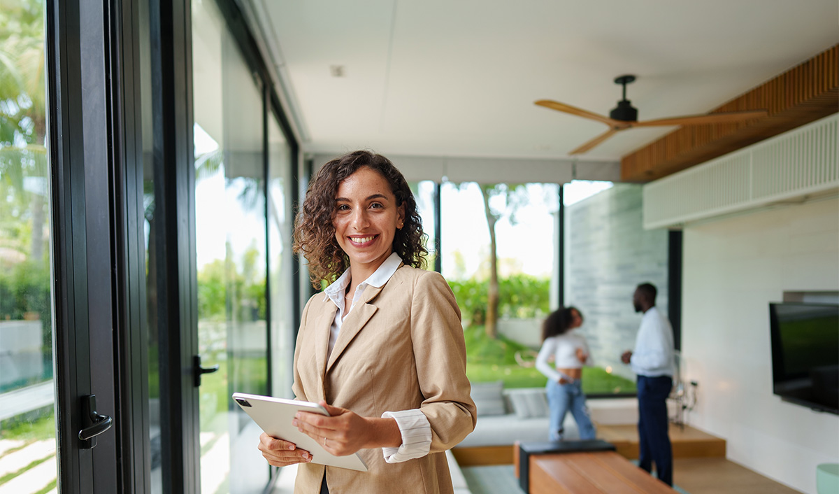 Woman in professional attire smiling at the camera